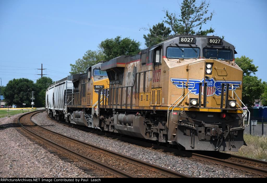 Grain train rolls east